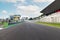 Motor sport circuit asphalt track empty starting line front view grandstands on the right