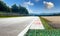 Motor sport circuit track background curb close up on straight and green field