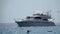 Motor yacht with people sailing on the waves. Slow motion