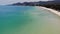 Motor yachts in blue sea on resort. Modern motor yachts floating on calm surface of blue sea near beach on sunny day on tropical