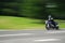 Motorbike in Blurred Motion driving on Country Road