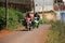 Motorbike carry farmers come home after working day