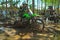 A motorbike cross racer is practicing on a muddy track