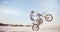 Motorbike, motorcycle athlete and desert drive with mockup cycling in nature for sport adventure. Jump, freedom and