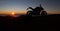 Motorbike parking with sunset background. Biker ride motorcycle. Silhouette of motobike. Trip and lifestyle motorbike Concept