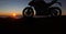 Motorbike parking with sunset background. Biker ride motorcycle. Silhouette of motobike. Trip and lifestyle motorbike Concept