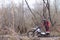 Motorbike racer with his vehicle stuck in mud