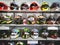 Motorbike sports helmets on the shelves of a specialized shop