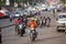 Motorbike taxis on a wide avenue in the capital city, Kampala, Uganda.