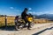 Motorbike traveler in mountains
