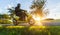 Motorbiker riding on empty road with sunset sky