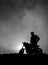 Motorbiker in the sunset, Azores, Sao Miguel island, silhouette, black and white, vertical.