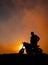 Motorbiker in the sunset, vertical, Azores, Sao Miguel island, silhouette.