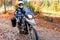 Motorbiker travelling in autumn mountains