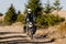 Motorbiker travelling in autumn mountains