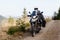 Motorbiker travelling in autumn mountains