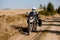 Motorbiker travelling in autumn mountains