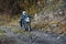 Motorbiker travelling in autumn mountains