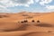 Motorbikers driving off-road in the Erg Chebbi desert near Merzouga in Morocco