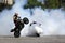 Motorbikes drift white smoke wheel