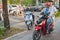 Motorbikes drive on the sidewalk in Ho Chi Minh City, Vietnam