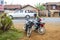 Motorbikes parked next to the road, Laos