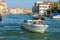 Motorboat Cruising down the Grand Canal in Venice on October 12, 2014. Unidentified people