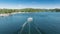 Motorboat driving fast along Lake Arrowhead in the San Bernardino Mountains