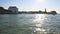 Motorboat floating on Grand Canal, sun reflections on water, transportation