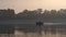 Motorboat floating park lake autumn evening. Modern cutter sailing calm pond.