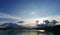 Motorboat, lake, mountain and cloudscape landscape photo