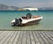 Motorboat moored by jetty