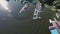 Motorboat moored at the pier. Aerial top view of boats and yachts from above.