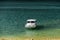 Motorboat moored on the turquoise lake surface