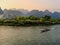 Motorboat moving on Nam Song River at susnet in Vang Vieng, Vientiane Province, Laos