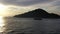 Motorboat pass out Victoria Harbour at dusk