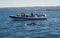 Motorboat with passenger near whale landscape photo