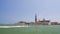 Motorboat sailing near beautiful San Giorgio Maggiore island in Venice, tourism