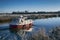 Motorboat sailing on Ribe River