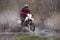 Motorcross rider racing in flooded wood