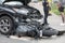 Motorcycle accident, bike stuck under car