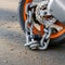 Motorcycle anti-theft chain with padlock security lock on rear wheel