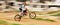 Motorcycle, balance and motion blur with a man on space at a race course for dirt biking. Bike, fitness and power with a