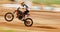 Motorcycle, balance and motion blur with a man training for a race or dirt biking challenge on space. Bike, fitness and