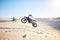 Motorcycle, desert race and jump in air for competition, stunt and outdoor for performance, goal and speed. Motorbike