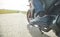 Motorcycle driver riding alone on asphalt motorway