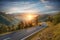 Motorcycle driver riding in Alpine highway. Outdoor photography, mountain landscape.