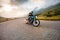 Motorcycle driver riding in Dolomite pass, Italy, Europe.