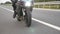 Motorcycle driving at asphalt route. Wheel of modern sport motorbike riding fast at highway. Motor bike racing on