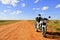 Motorcycle on an empty dirt road Outback Australia
